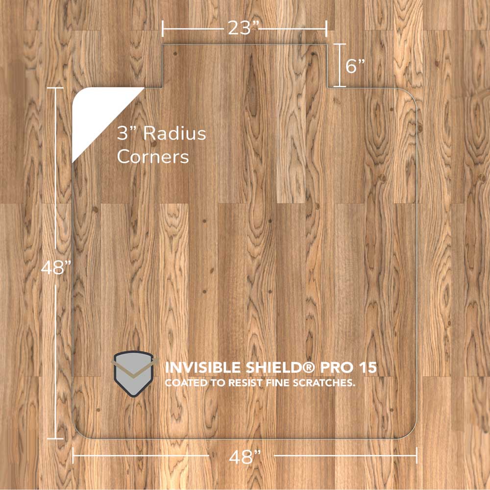#glass clarity_luminoso (low-iron ultra clear) alt="A rectangular "luminoso" glass chair mat with dimensions 48 inches by 48 inches, featuring a 23-inch wide top section and 6-inch extension, and 3-inch radius corners. The mat is labeled with "INVISIBLE SHIELD® PRO 15 COATED TO RESIST FINE SCRATCHES." and is placed on a wooden floor."