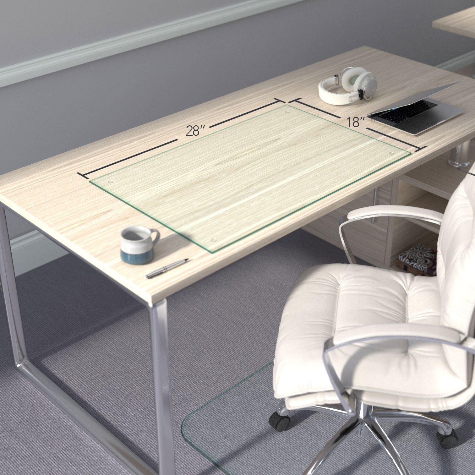 A minimalist desk setup with a light wood finish, featuring a "chiaro" glass desk blotter measuring 28 inches by 18 inches. On the desk, there is a mug, a pen, a pair of headphones, and a laptop. A white office chair is positioned in front of the desk. The room has gray carpeted flooring and light gray walls with white baseboards. #Size_18x28#Glass_Clarity_Chiaro