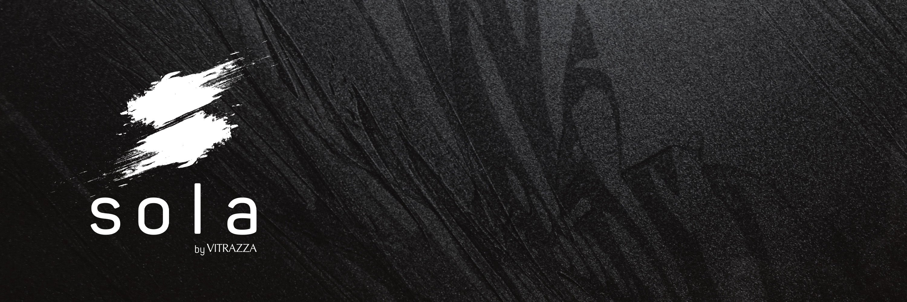 Logo for "Sola" by Vitrazza, featuring a stylized white paintbrush stroke symbol above the text on a dark, textured background.