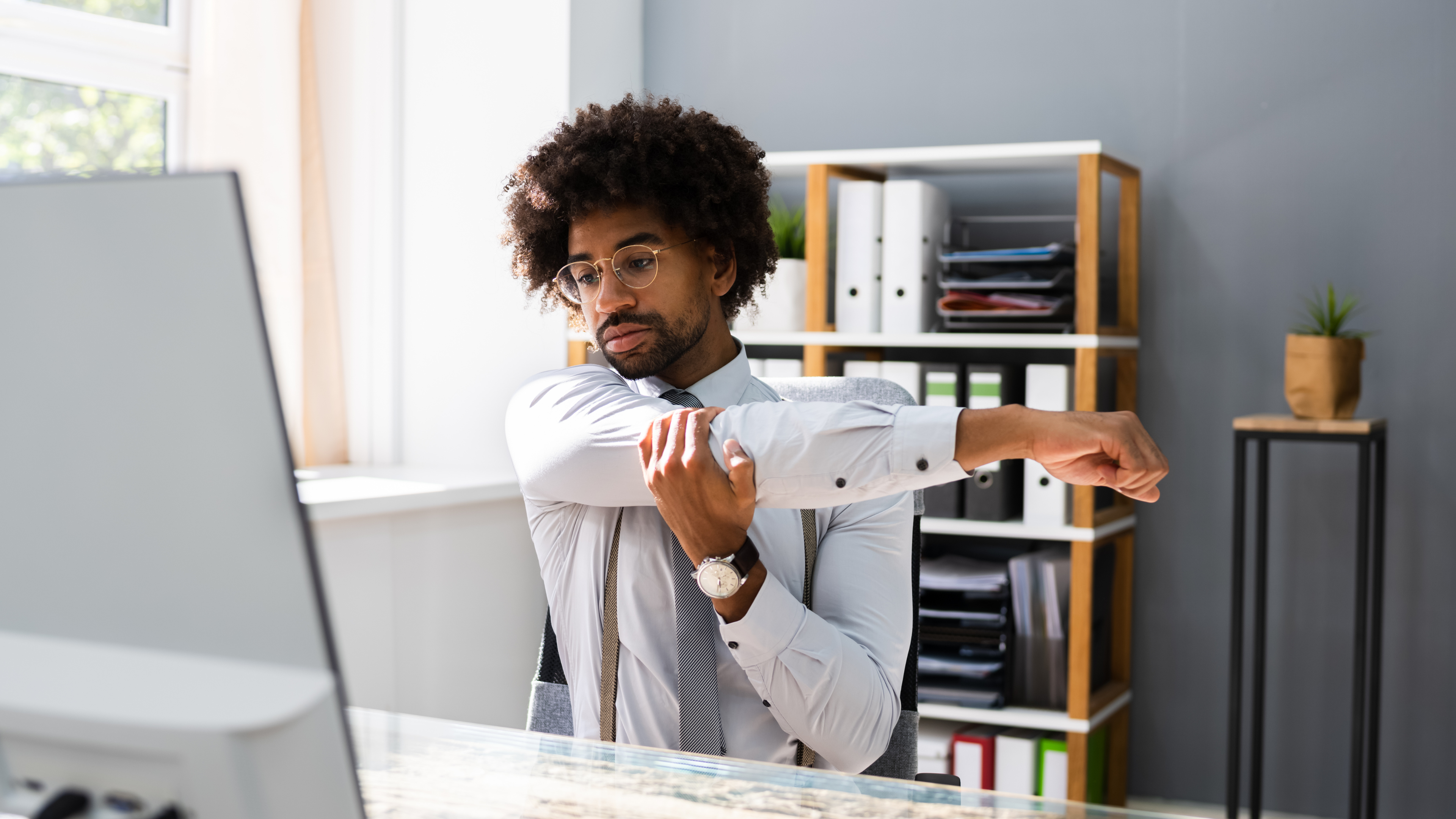 8 Stretches to Do at your Desk to Stay Productive and Pain-free