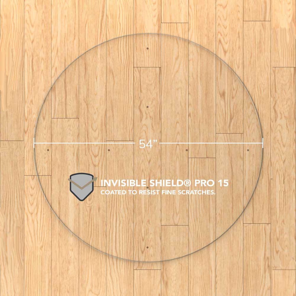 #glass clarity_luminoso (low-iron ultra clear) alt="A round "luminoso" glass chair mat with a diameter of 54 inches, placed on a wooden floor. The mat is labeled with "INVISIBLE SHIELD® PRO 15 COATED TO RESIST FINE SCRATCHES."
