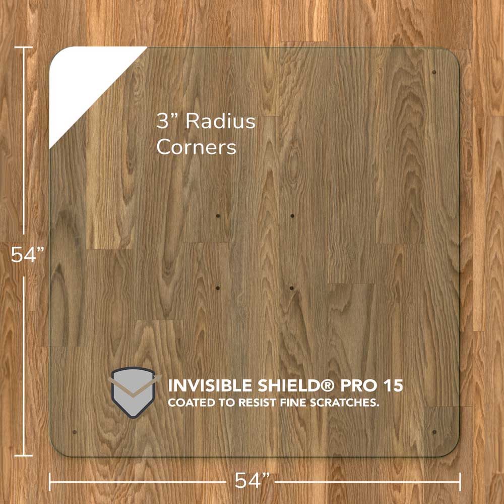 #glass clarity_chiaro (standard clear) alt="A chiaro glass chair mat with dimensions of 54 inches by 54 inches, featuring 3-inch radius corners. The mat is labeled with "INVISIBLE SHIELD® PRO 15 COATED TO RESIST FINE SCRATCHES." and is placed on a wooden floor."
