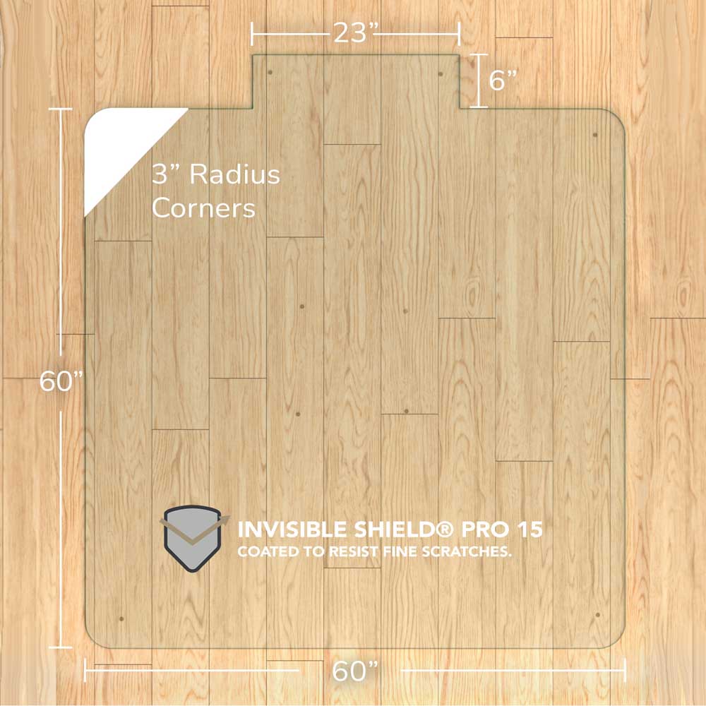 #glass clarity_chiaro (standard clear) alt="A rectangular "chiaro" glass chair mat with dimensions 60 inches by 60 inches, featuring a 23-inch wide top section and 6-inch extension, and 3-inch radius corners. The mat is labeled with "INVISIBLE SHIELD® PRO 15 COATED TO RESIST FINE SCRATCHES." and is placed on a wooden floor."
