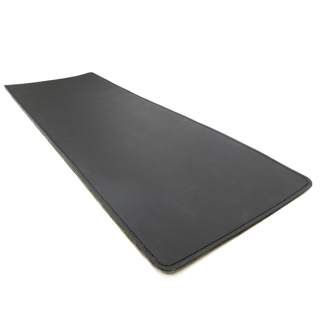 #color_charcoal A sleek, black leather desk mat photographed against a white background. The mat is rectangular with neatly stitched edges.
