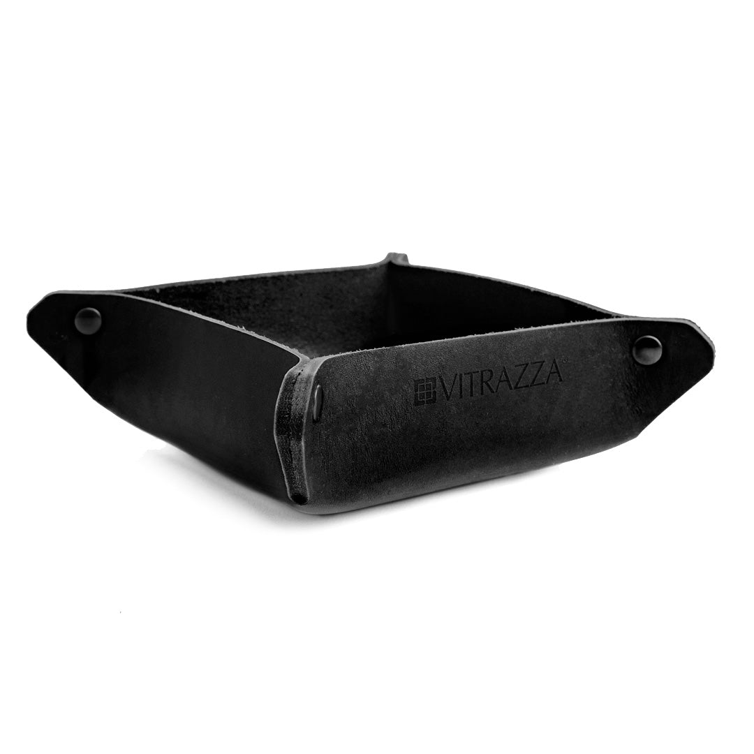 #color_charcoal alt="A black leather desk organizer. It is empty and placed against a white background. The organizer has a simple design with black rivets at the corners."