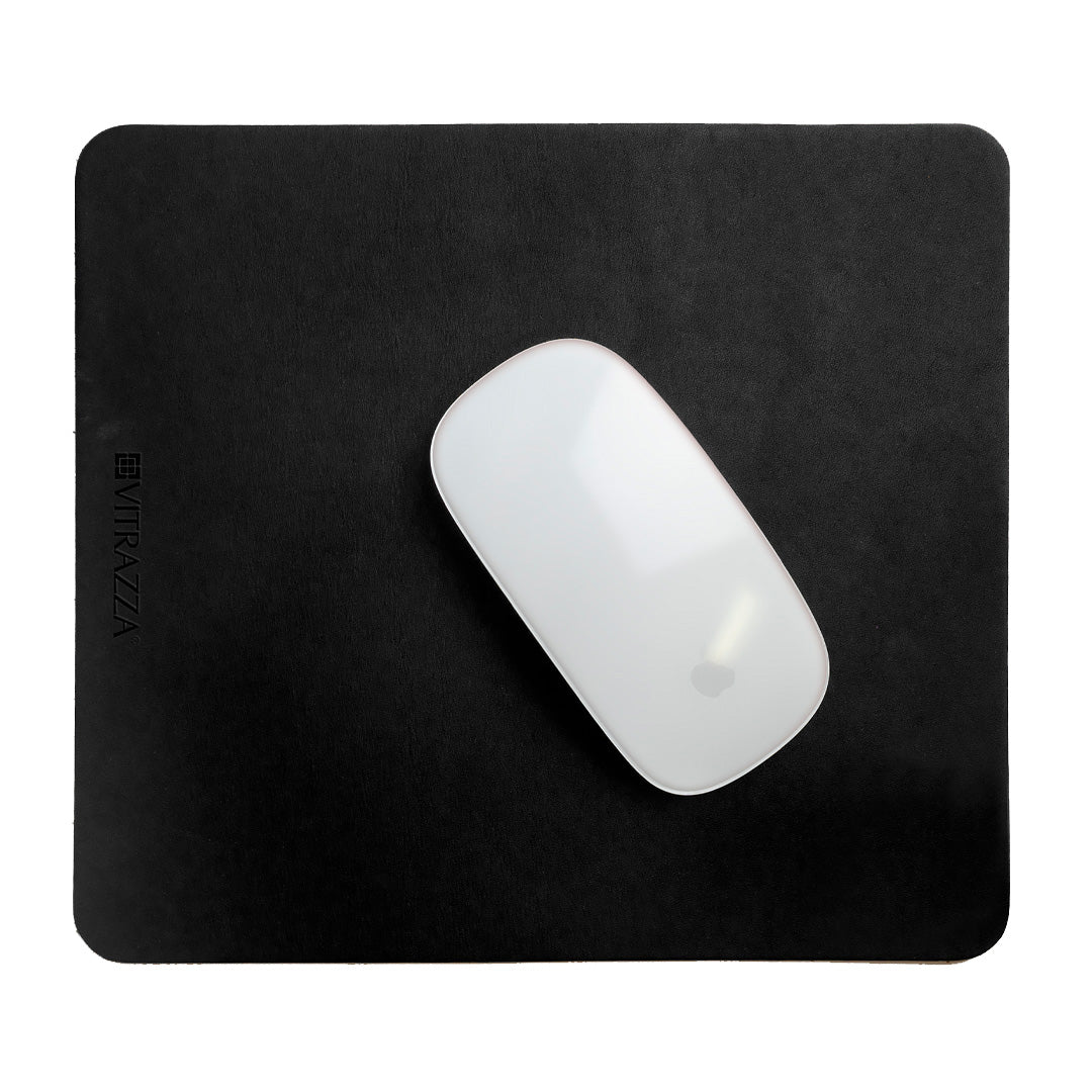 #color_charcoal alt="A white wireless mouse is placed on top of a black leather mouse pad. The mouse pad has the brand name "VITRAZZA" on it. The background is plain white."