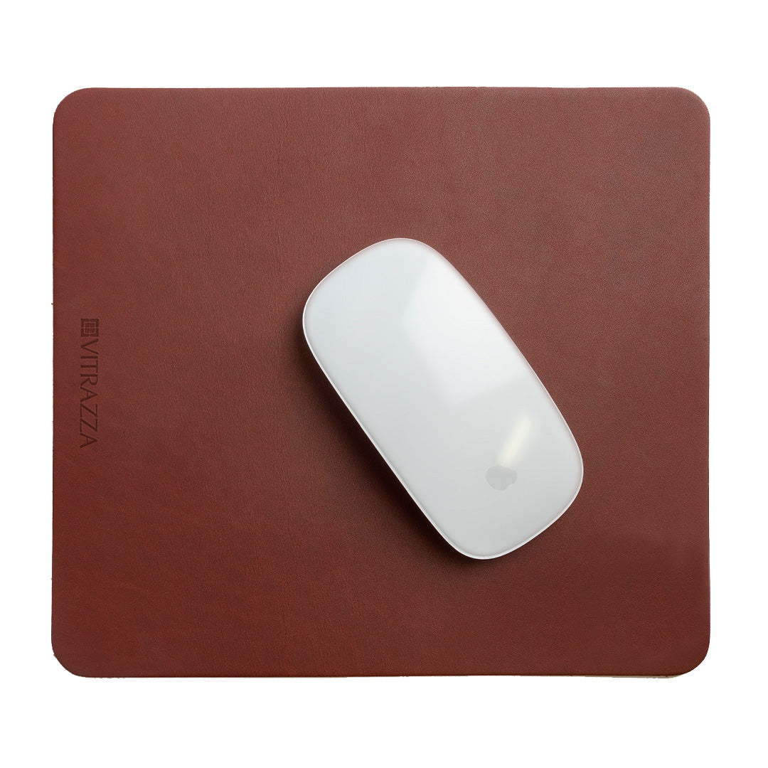 #color_mahogany alt="A white wireless mouse is placed on top of a brown leather mouse pad. The mouse pad has the brand name "VITRAZZA" on it. The background is plain white."