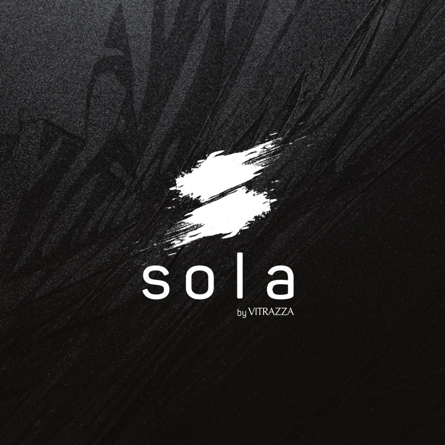 "A dark textured background with a logo in the center. The logo consists of a white, brushstroke-like 'S' shape above the text 'sola' in lowercase letters. Below 'sola,' the text 'by VITRAZZA' is written in smaller font."